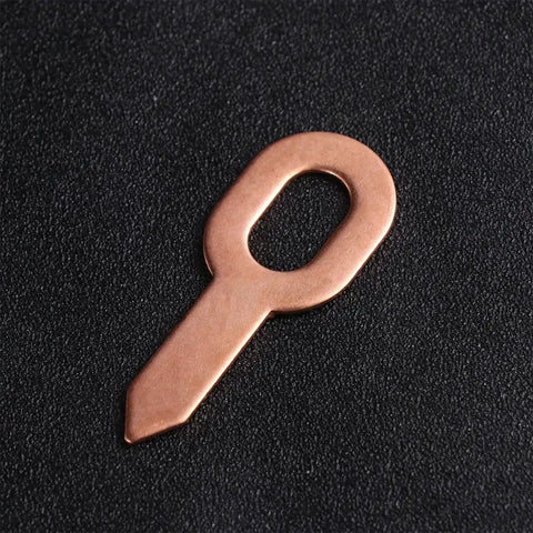 Awesome 50 Pcs Aluminum Sheet Metal Repair Kit With Smooth Edges And Ergonomic Design Golden Welding Pull Clamps For Car Bodywork And Machine Parts Fixin Job, golden clamp detail on textured surface.