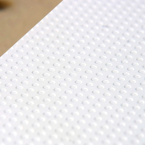 Close-up of micro dot surface on Knockout Rock Solid Micro Dot Drill Press Table Kit with textured pattern.
