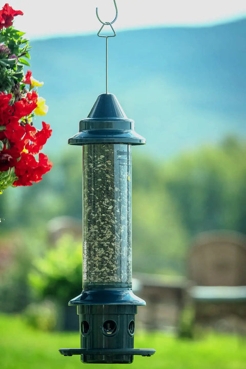 Ultra Squirrel-Proof Bird Feeder With Cardinal Ring And Six Feeding Ports, Large 5.1 Pound Seed Capacity, hanging outdoors