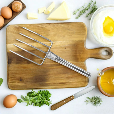 Stainless Steel Bean Sprout Hand Fork For Digging And Transplanting Beefy Heavy Duty Garden Tool displayed on wooden cutting board