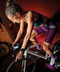 Cyclist on bike using Edge 1050 Premium All In One Cycling Computer Gift Box Bundle With Color Touchscreen Built In Speaker