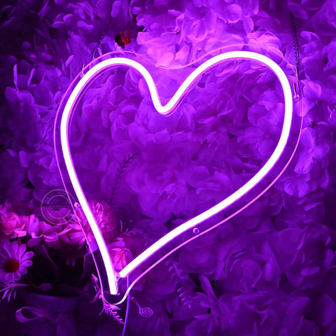 Heart Shape LED Neon Light Sign 13.4 Inch Wall Hanging Neon Vibe Decor with purple glow against floral background.