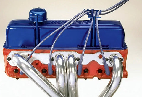 Red Four Hole Spark Plug Wire Loom Kit with Chrome Brackets installed on engine, showcasing neat wire arrangement.
