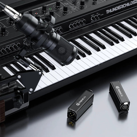 HumBlock XLR Series Single Channel Ground Loop Noise Isolator with keyboard and microphone setup in studio with male and female connections