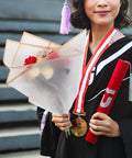 Graduate holding a bouquet wrapped in Floral Bouquet Wrapping Paper Waterproof Protective Wrap Paper 20 Sheets Cuttable For Flowers and Bouquets