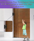 Child reaching for a stainless steel 90 degree right angle sliding door lock for barn doors, matte black finish, on a wooden door.