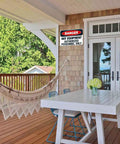 Danger Hot Equipment Warning Sign Authorized Personnel Only 8x12 Inch Aluminum Metal on porch wall with hammock and table.