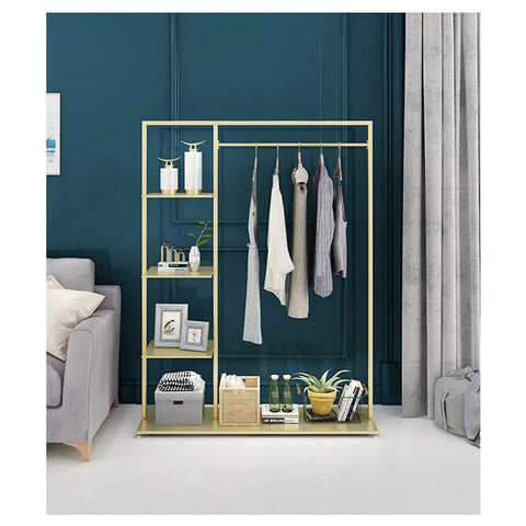 Top Shelf Golden Metal Garment Rack With Five Tier Storage Shelves showcasing hanging clothes and decorative items.