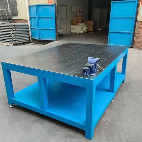 Rock Solid No Nonsense Heavy Duty Workbench For Welding And Metal Fabrication With 8mm Thickened Steel Plate, blue frame, flat top, and vice.