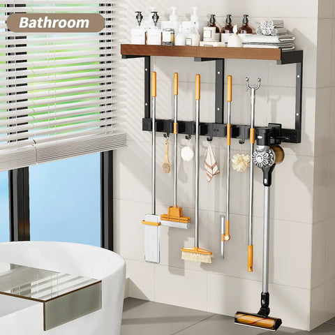 Space Saving Wall Mount Broom Holder With Cleaning Supplies Organizer, Mop Rack, Vacuum Organizer And Shelf installed in a bathroom