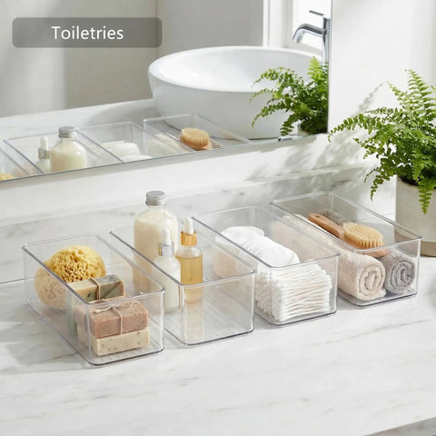 8 Pack Deep Drawer Organizers For Kitchens Closets And Bathrooms Super Solid Storage Bins holding toiletries on a bathroom countertop.