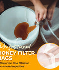 Pouring honey into six pack ultra fine honey filter bags with food grade nylon mesh for five gallon buckets.