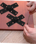 Installing Heavy Duty Stainless Steel Pivot Hinges For Hidden Secret Doors on wooden surface, black hardware shown
