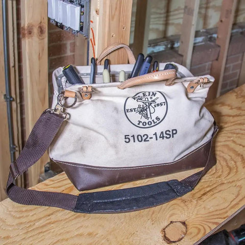 Tough As Nails 14 Inch Tool Bag With Detachable Shoulder Strap, 10 Interior Pockets For Hand Tool Organization on wooden workbench