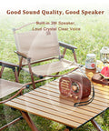 Retro Portable Bluetooth Speaker Radio With FM AM SW Bands on outdoor table beside folding chairs and picnic setup with watermelon.