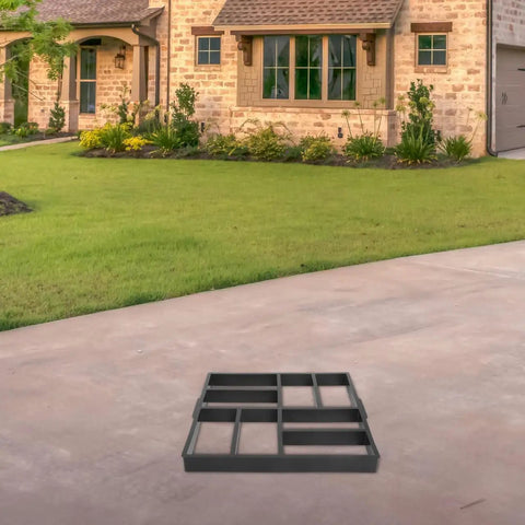 Plastic Path Maker Mold For Concrete Pavers 16.45 inch on driveway, ready for DIY landscaping projects, easy to use and durable.