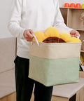 Man holding Large Cube Storage Baskets For Clothes Toys Towels Books Collapsible Canvas Bins With Cotton Handles Tough As Nails