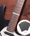 Fretboard Protector Kit For Guitar Frets Polishing And Guard Pads Includes Fret Grinding Pads And Polishing Paper Fits Most Wooden And Electric Guitars Bass Friendly For Smooth Shiny Fret Surfaces, shown on electric guitar fretboard with polishing sheets