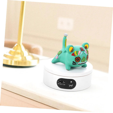 Luxshiny Electric Jewelry Rotating Turntable Display Stand With Smooth Auto-Spin Action For Storefronts And Home Organization showcasing colorful decorative figure on white acrylic base.