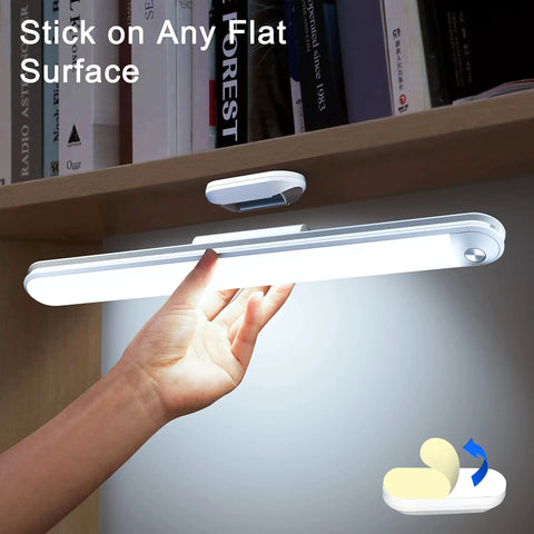 Person installing Rechargeable Dimmable Touch Light Bar With Three Color Temperatures 3000K 4000K 5000K, 30 LED Wireless Stick On Lamp