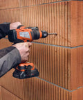 Tough As Nails Badass Cordless Impact Drill With Two Speed Settings and Full Metal Gearbox, drilling masonry wall.