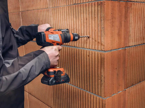 Tough As Nails Badass Cordless Impact Drill With Two Speed Settings and Full Metal Gearbox, drilling masonry wall.