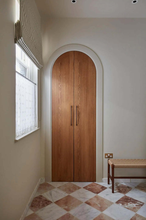 Wooden closet doors with Black Zinc Alloy Cabinet Handles Set of 6, 12.6 Inch Center To Center Pulls in a beige room.