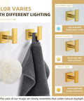 Brushed Dark Gold Towel Hooks For Bathroom Stainless Steel Wall Mount Square Robe Coat Hangers Hand Towel Holder 2 Pack displayed under different lighting conditions.
