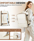 Woman wearing Go-To Travel Backpack for Women and Men Carry On Luggage Flight Ready Personal Item Essentials Waterproof Laptop Backpack Large Capacity Daypack Brown Beige