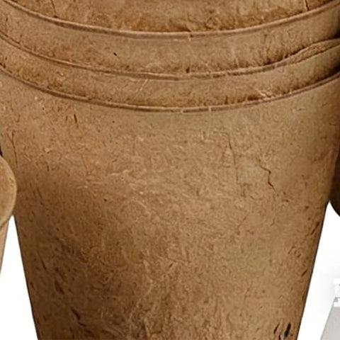 Stack of biodegradable seedling pots from Seedling Pots 45 Pack With Labels For Easy Germination And Root Care, close-up view.