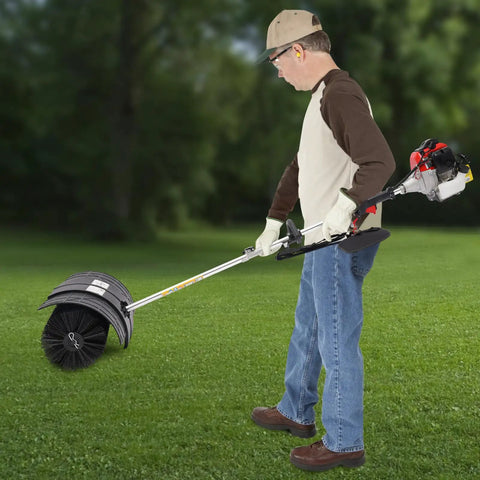 Gas Powered Handheld Sweeper Broom For Lawn Cleanup 52cc 2 Stroke Engine Two Point Three HP Portable Gasoline Powered Sweeping Machine With Fuel Tank Built To Last Durable ABS Aluminum Build Easy Start And Debris Removal, side view on grass