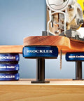 XL Risers For Bench Cookie Plus And Connect Work Grippers used under a wood board with a saw, showing 5-inch height adjustment.
