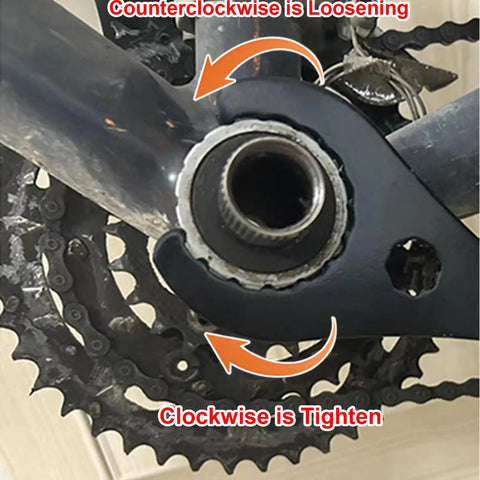 Close-up of a bike bottom bracket removal tool set in use, showing direction arrows for bicycle crank tightening and loosening.