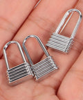 Heavy Duty Metal Zipper Pull Tabs For Backpack Repair Silver Replacement Sliders in hand close-up view.
