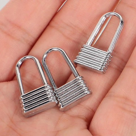 Heavy Duty Metal Zipper Pull Tabs For Backpack Repair Silver Replacement Sliders in hand close-up view.