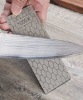Using 11 Piece Diamond Sharpening Stone Set With Angle Guide And Leather Strop, Whetstone Honeycomb Surface With Non Slip Base, Ideal For Knives And Scissors, Pro Grade Sharpener Kit With 180 To 3000 Grit on a knife