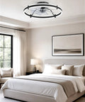 Modern 24 Inch Low Profile Ceiling Fan With Dimmable LED Light And Wireless Remote Slick Black Design in a bedroom setting.