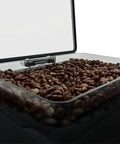 Kickstart Your Daily Java With This Slick Super Automatic Espresso Machine Featuring A Bpa Free Design with coffee beans in a transparent container.