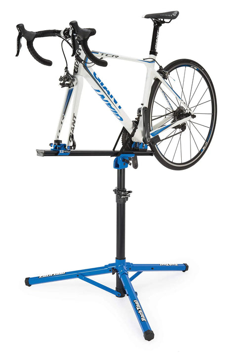 Bike secured on PRS-22.2 Team Issue Repair Stand For Bikes Adjustable Heavy-Duty Bicycle Work Stand With Rock Solid Stability, blue finish