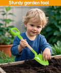 Child playing with Three Piece Metal Beach Shovel Set For Kids, 16 Inch Sand Shovels With Wooden Handles in garden