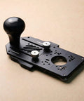 Top Shelf Nine In One Router Jig Kit For Weekend Warriors, black aluminum base with adjustment knobs for precision routing.