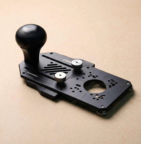 Top Shelf Nine In One Router Jig Kit For Weekend Warriors, black aluminum base with adjustment knobs for precision routing.