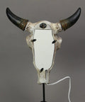 Back view of Southwestern Style Steer Skull Resin Wall Sconce Or Table Lamp with removable metal stand and LED bulb, rustic decor.