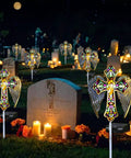 Solar Glass Cross Garden Stake Light With Angel Wings And Stained Glass Look No Fuss Dusk To Dawn Outdoor Cemetery Path Lamp illuminated at night