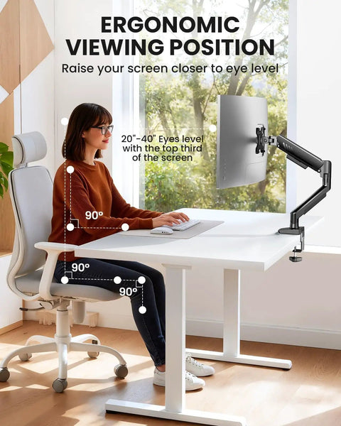Fully Adjustable Monitor Arm for 13 to 34 Inch Monitors with Tool Free VESA Mount set on desk, showing ergonomic setup with user.