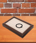 Crafted From Warm Wood This Super Chic 30 Compartment Jewelry Organizer Stores Rings Necklaces And Bracelets Straight Up In Style While You Kick Clutter To The Curb And Look Awesome Daily with black beaded bracelet in one compartment.