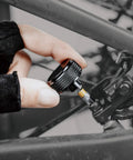 Adjusting bolt with Pro Grade Adjustable Torque Kit 2 To 10 Nm With 9 Bit Set on a bike component close-up