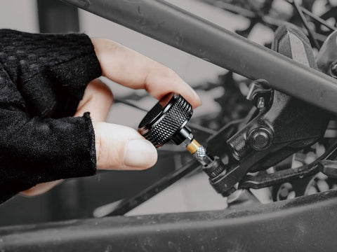 Adjusting bolt with Pro Grade Adjustable Torque Kit 2 To 10 Nm With 9 Bit Set on a bike component close-up