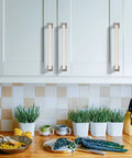 10 Pack 5 Inch Brushed Satin Nickel Cabinet Pulls Zinc Alloy Kitchen Cabinet Handles installed on white cabinets in a kitchen setting