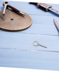 Top Rated Rust Proof Stainless Steel M10x60 Eye Bolt with nut on a blue wooden surface, used for heavy rigging.